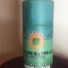 Sunscreen bottle with teal and green color, orange sunburst logo, and "Sunmade Naturals" text