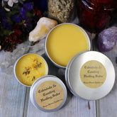 Healing Salve tins with yellow balm, silver metal, and Hayes Haven Apothecary label