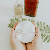 Facial Rounds white cotton pads held in hands with FarmGirlDesign label