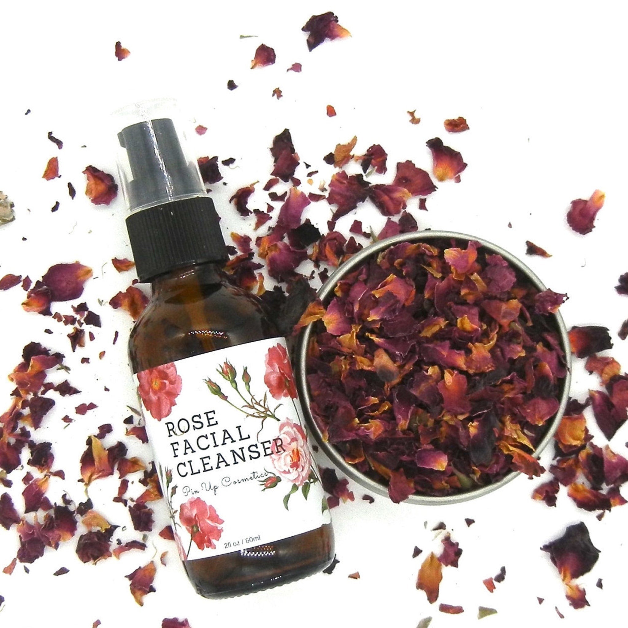 Rose Facial Cleanser brown glass bottle with label, rose petals, and Pin Up Cosmetics text