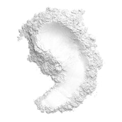 White powder with textured surface and smooth area on white background