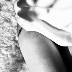 Set of three skin-safe temporary tattoos with floral designs in a sleek black package