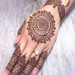 Close-up of natural brown henna cone with detailed texture, showcasing smooth consistency for precise skin application