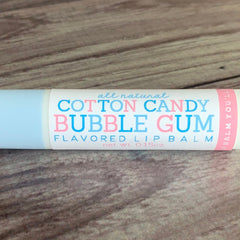 Lip balm tube with blue and white, pink text, and Cotton Candy Bubble Gum flavor