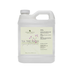 Tea tree water white plastic jug with handle, label with Organic Pure Oil text