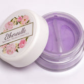 Eye makeup, lavender matte eyeshadow in a clear jar, white lid with floral design, Etherealle brand