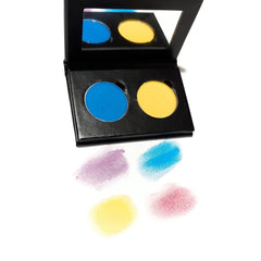 Eyeshadow palette with blue and yellow shades, black compact, and color swatches below