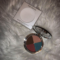 Close-up of TIGI Eye Shadow Palette showing six vibrant matte and shimmer shades in a sleek black compact