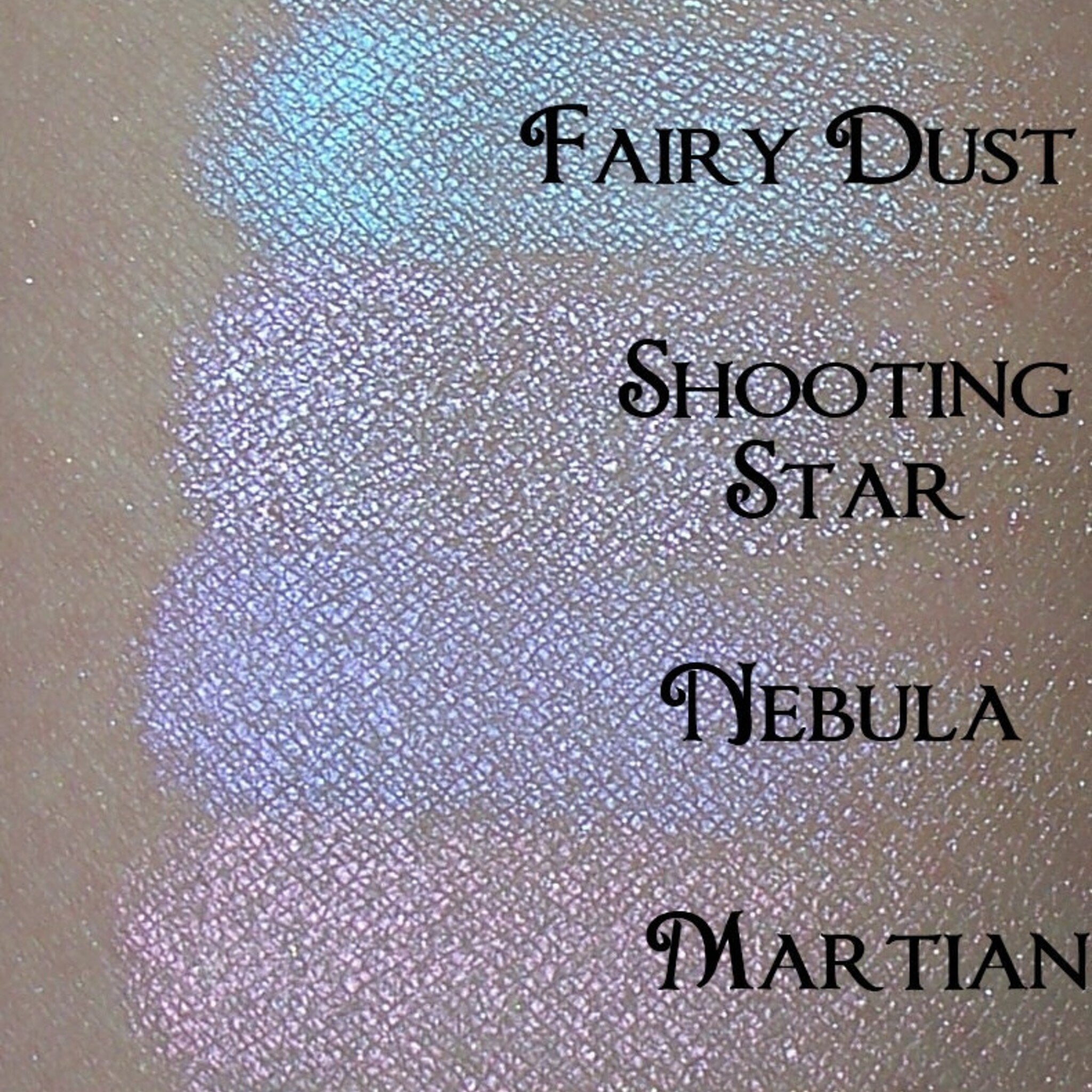 Stackable iridescent eyeshadow palette with six cool-toned shades in a sleek compact case