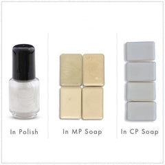 Nail polish bottle with black cap and white liquid, plus rectangular soap samples in yellow and gray colors