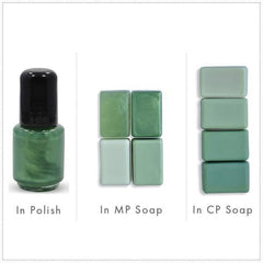 Green nail polish bottle with black cap, and green soap bars in different shades