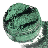 Eyeshadow powder, matte forest green color in clear jar, loose pigment visible