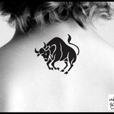 Chic Taurus zodiac temporary tattoo in gold on skin, pre-cut for easy application with delicate celestial details