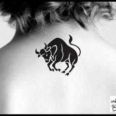 Chic Taurus zodiac temporary tattoo in gold on skin, pre-cut for easy application with delicate celestial details