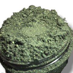 Fresh forest green shimmer eyeshadow in compact with reflective mineral finish and smooth satin texture.