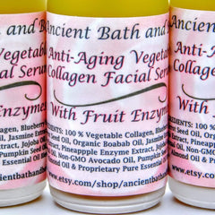 Facial serum bottles with pink labels, black text, and Ancient Bath brand name displayed