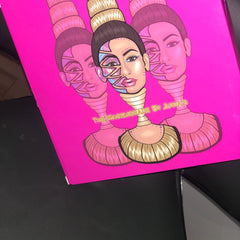 Makeup palette with pink background, illustrated faces, and "The Masquerade by Juvia's" text