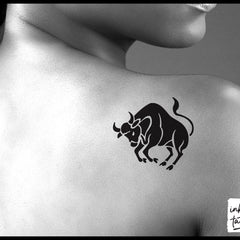 Close-up of Taurus zodiac temporary tattoo showing intricate metallic design on skin-safe adhesive sheet