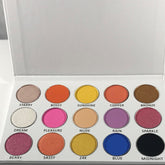 Open rectangular palette displaying 15 vibrant tropical eyeshadows in matte and shimmer finishes with mirror inside