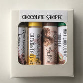 Lip balm set with Chocolate Shoppe branding, colorful tubes in a white box, for lip care