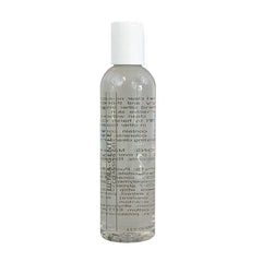Facial cleanser bottle with white cap, clear body, and product text label