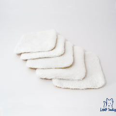 White microfiber face cloths with yellow trim, Loup Indigie logo visible