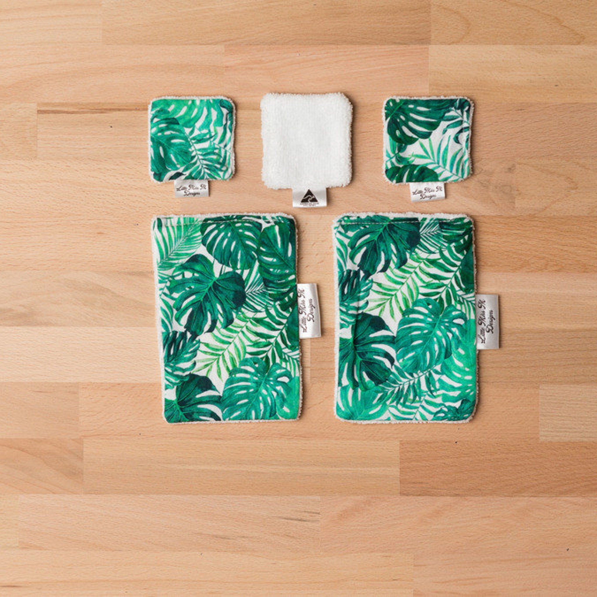 Reusable makeup wipes with green leaf pattern, white trim, and Little Miss M Designs label