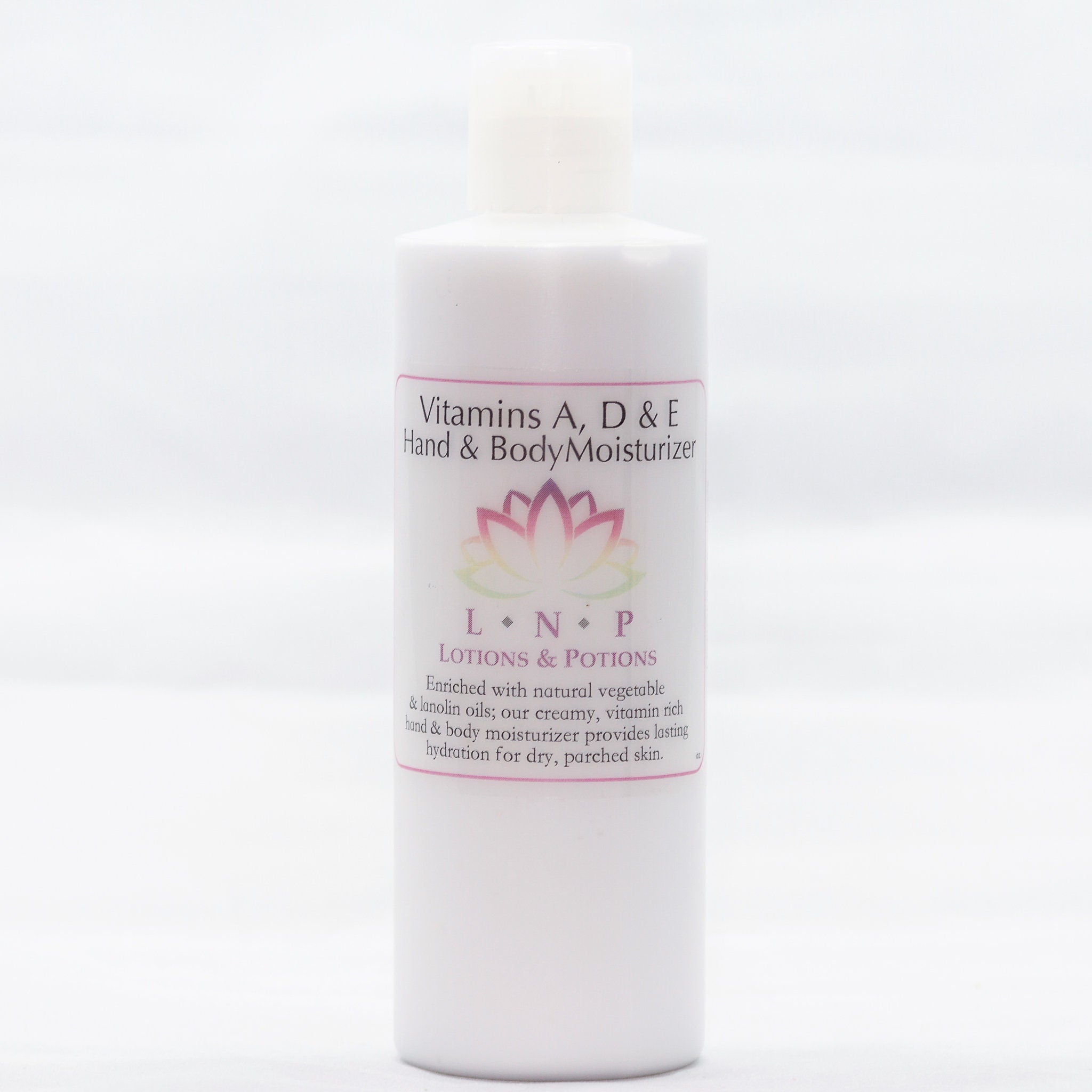 Amber glass bottle of vitamin A D E serum with gold dropper and minimalist black label