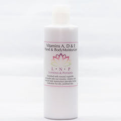 Amber glass bottle of vitamin A D E serum with gold dropper and minimalist black label