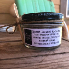 Glass jar with black lid, twine, and wooden spoon, Bear Creek Ranch label