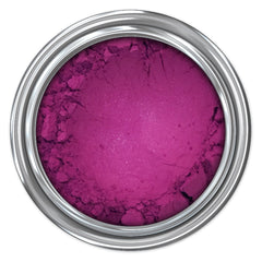 Magenta powder in a silver metal container, top-down view