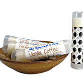 Lip balm tubes with white labels, brown text, and coffee cup pattern, Blue Poppy Bath & Body brand visible