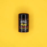 Facial cleanser mini balm in black and white cylindrical container, Pickles brand