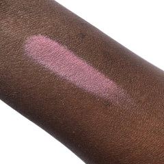 Pink eyeshadow swatch on dark skin, shimmery pigment, angled application