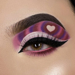 Eye makeup with purple, pink, and white swirl design, heart detail, and black eyeliner by BATGIRLEKTA