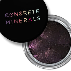 Mineral eyeshadow, dark purple with shimmer, in a silver container, Concrete Minerals brand