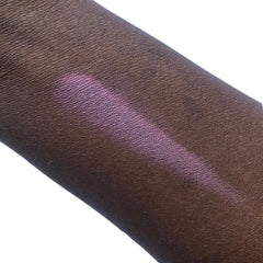 Swatched eyeshadow on skin, purple shimmer, dark skin tone, swatch test