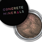 Mineral eyeshadow, brown powder with cracked texture, Concrete Minerals branding on black lid