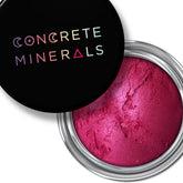 Mineral eyeshadow in magenta, silver container, Concrete Minerals brand on lid