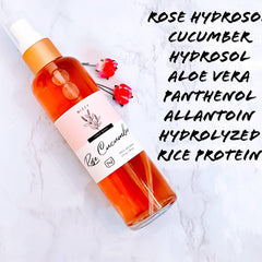 Toner spray bottle, orange liquid, white and gold accents, with rose detail, Nizzy brand visible