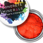 Eyeshadow pot with bright orange matte powder and Concrete Minerals branding on lid