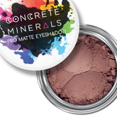 Eyeshadow powder with brown color, cracked texture, and silver metal container with Concrete Minerals text