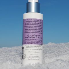 Aromatherapy spray bottle, white and silver, with purple label, aetherio love & science text visible