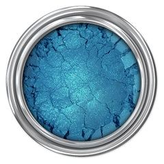 Close-up of West Coast mineral eyeshadow pan showing rich pigmented powder in a warm bronze shade with smooth texture