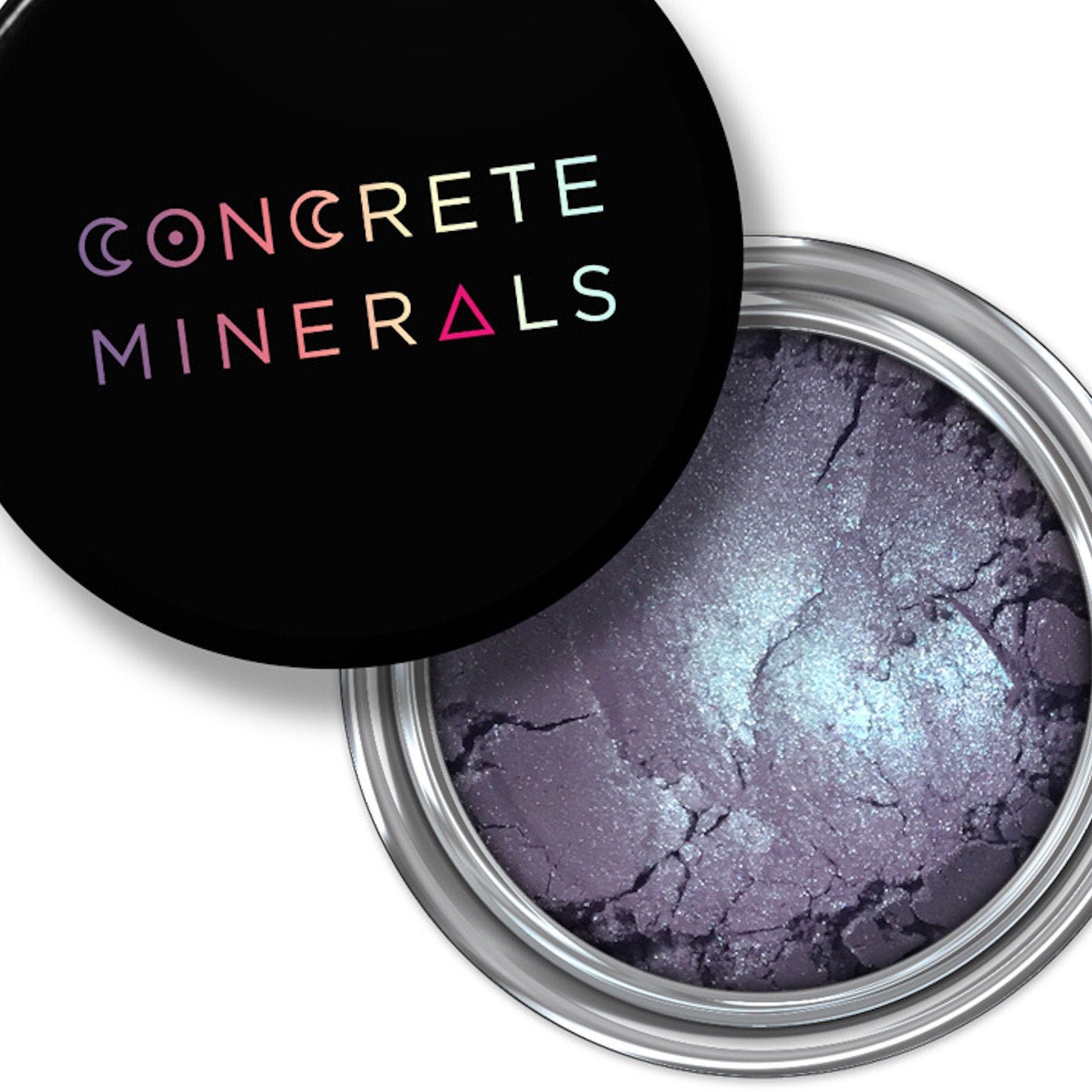 Eyeshadow pot with purple and silver shimmer, Concrete Minerals brand on black lid