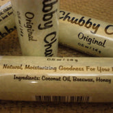 Lip balm tubes with beige paper, black text, and Chubby Chap brand name visible