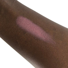 Side view of To Boldly Go mineral eyeshadow pot showcasing its metallic finish and compact circular design