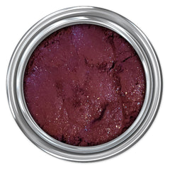 Close-up of shimmering taupe mineral eyeshadow with finely milled texture in compact case