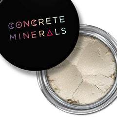 Mineral eyeshadow, light beige powder, silver rim, black lid with Concrete Minerals text