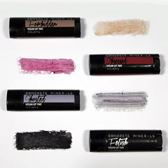 Vegan lip tint in black tube with Concrete Minerals text, swatches of various colors on white background